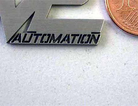 Laserschneiden Logo Edelstahl M2 vergrößerte Darstellung